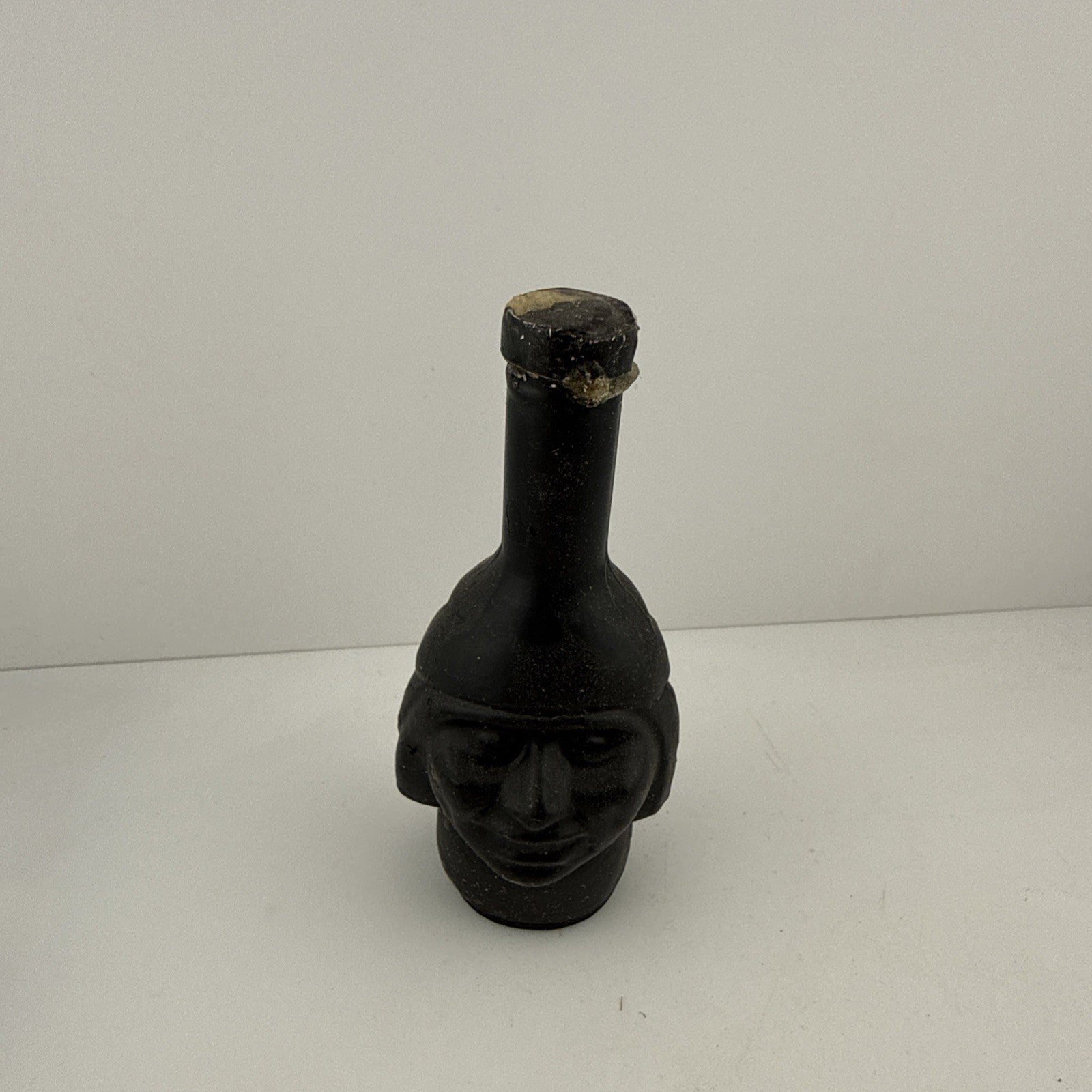 1950s–60s black glass figural head bottle miniature, full