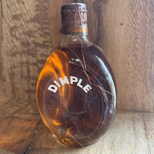 Dimple Whisky Metal spring top 1/4 bottle from 1970s