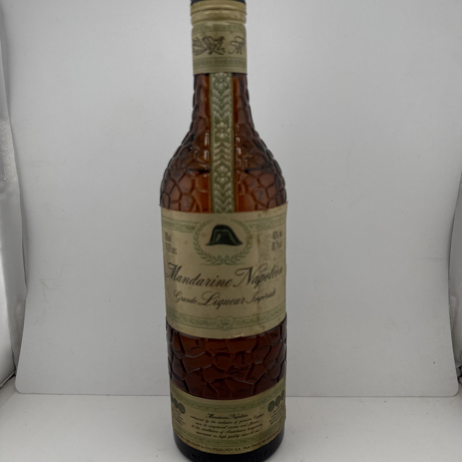 Mandarine Napoléon Liqueur; textured "citrus skin" bottle from the 1970s