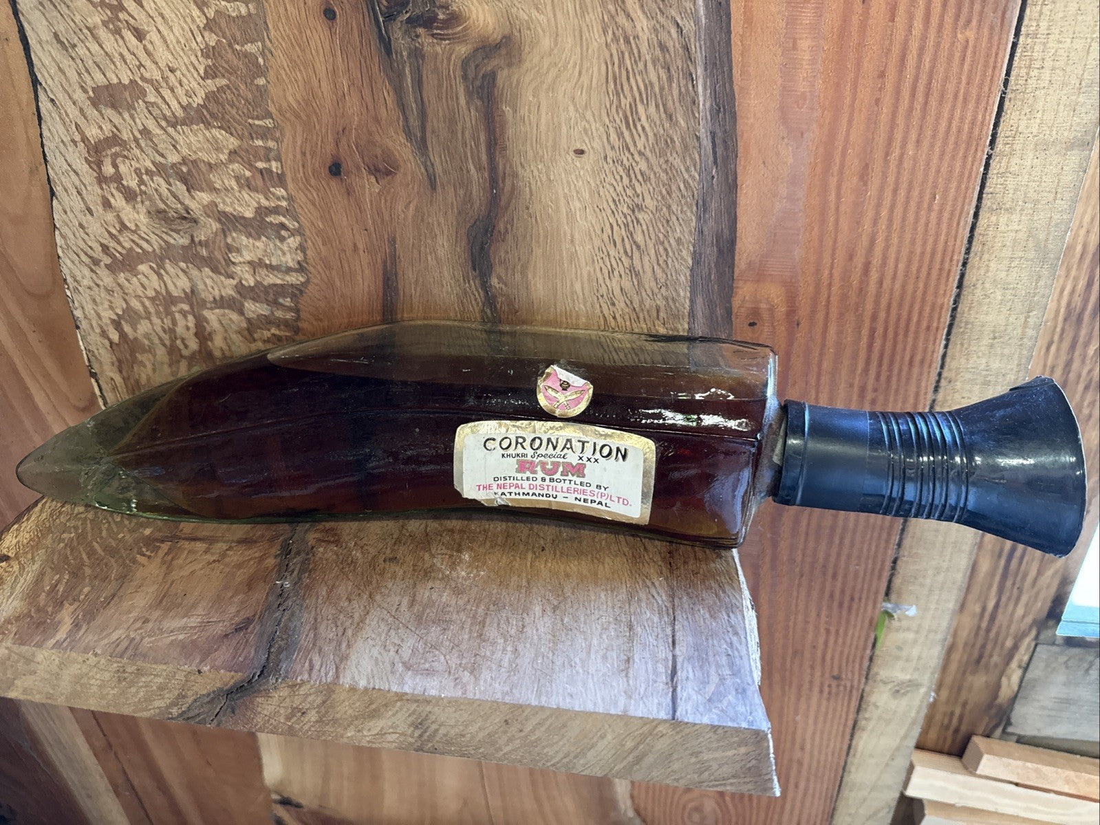 Old Coronation Rum From Nepal in Glass dagger bottle