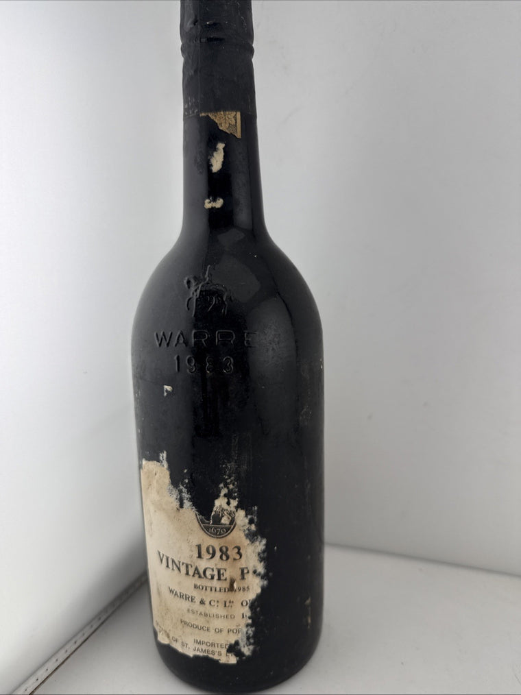 Warre’s 1983 Vintage Port, bottled 1985, sealed damaged label Good Level