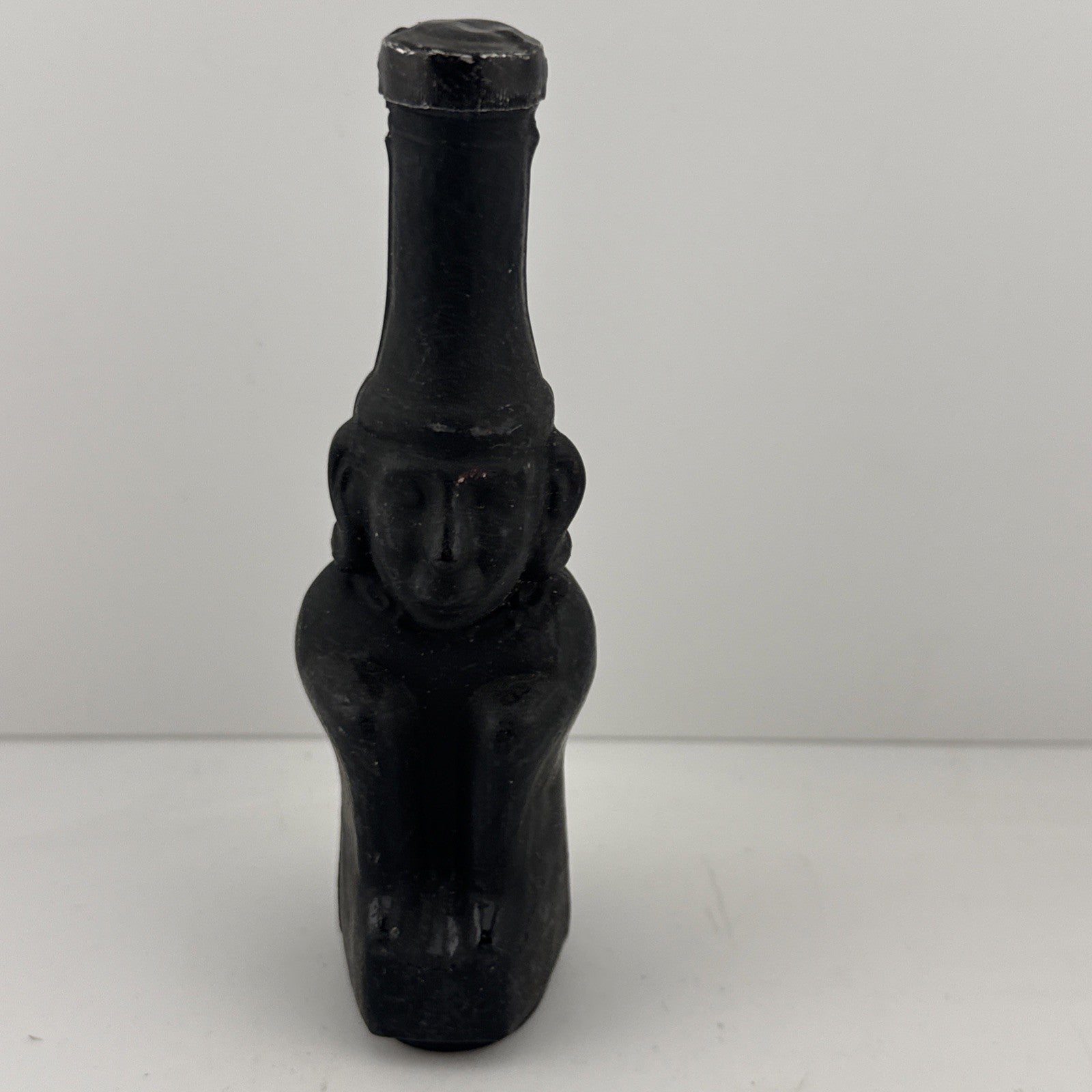 1950s–60s black glass figural bottle miniature, full