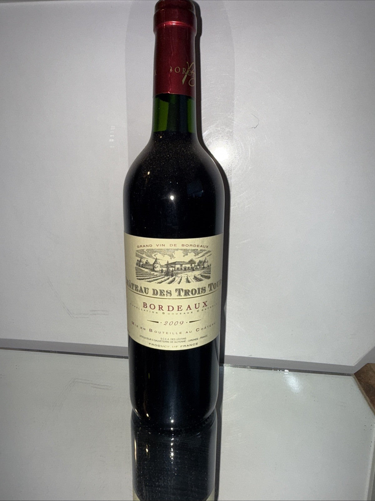 (750 ml) bottle of Château des Trois Tours Bordeaux AOC 2009