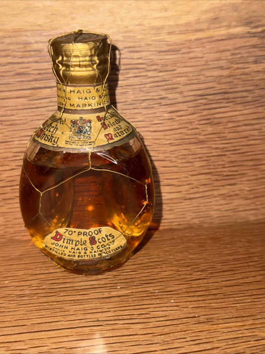 Haigs Dimple Whisky 1960sBottled 26 2/3 FLOZ And 70% proof Miniature Spring Cap