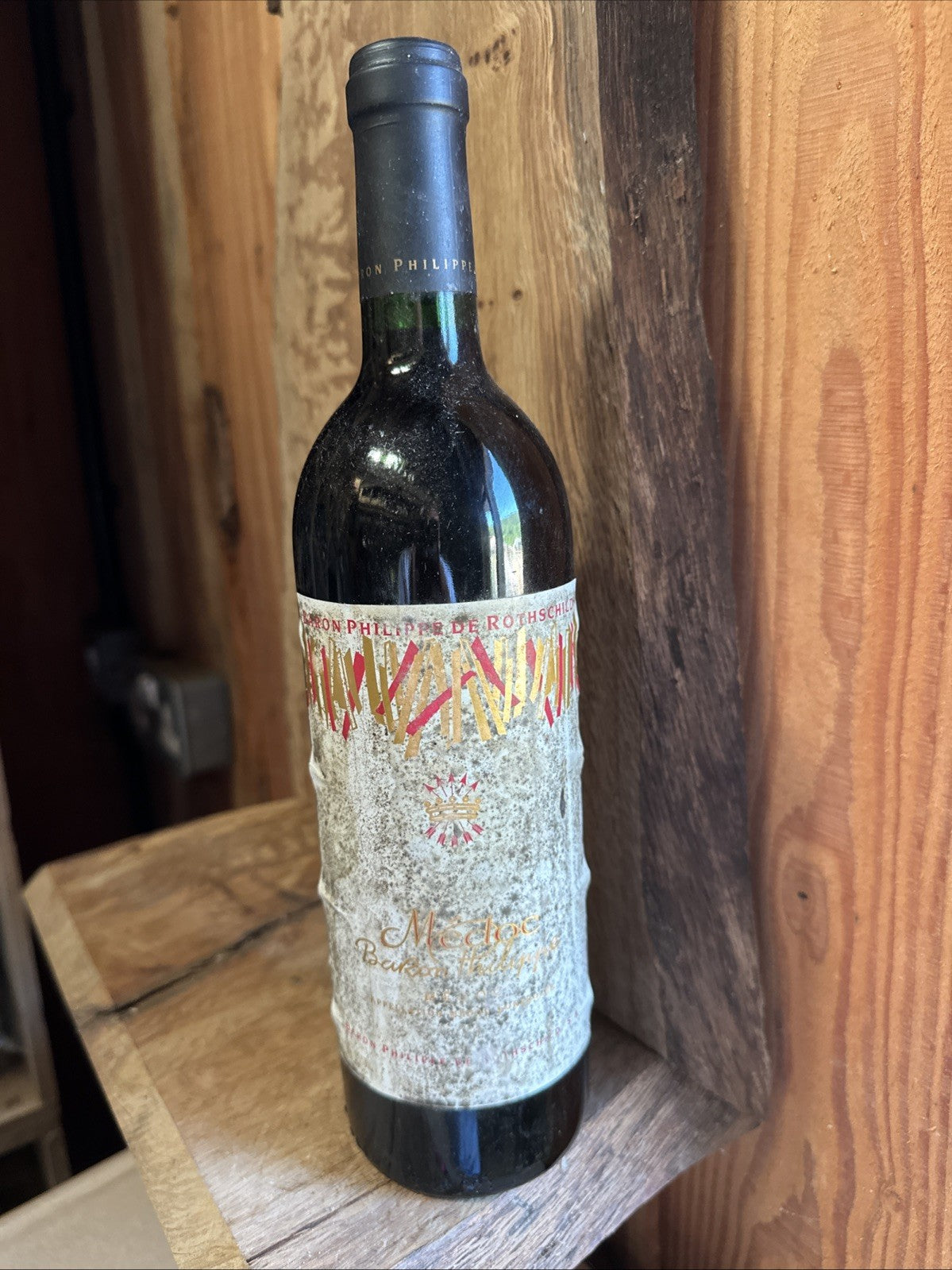 Baron Philipe de Rothschild Medoc (label in poor condition but wine looks fine)